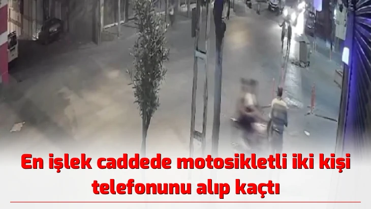 En işlek caddede motosikletli iki kişi telefonunu alıp kaçtı