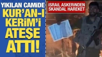 İsrail askerinden skandal hareket! Kur’an-ı Kerim’i ateşe attı